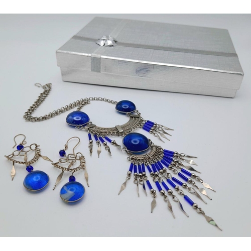 126 - A white metal (untested) necklace and earrings set in the style of Native American tradition, in a p... 