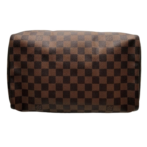 129 - A Louis Vuitton Damier Ebene Speedy Thirty Bag. Brown Damier Ebene canvas exterior with gold-toned h... 