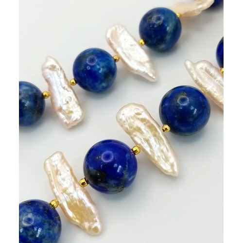 133 - An interesting and unique combination of lapis lazuli and elongate cultured pearls forming a necklac... 