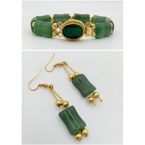 147 - A wonderful, probably of Chinese origin, gilded green jade bracelet and matching earrings set in a p... 