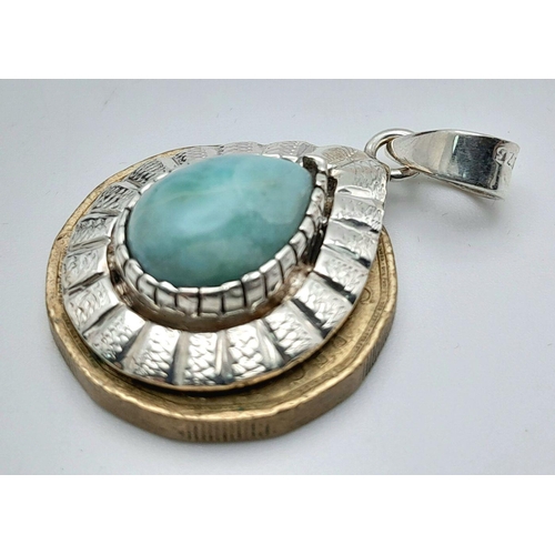 1495 - A Larimar Pendant. Set in 925 Sterling silver. 3cm.