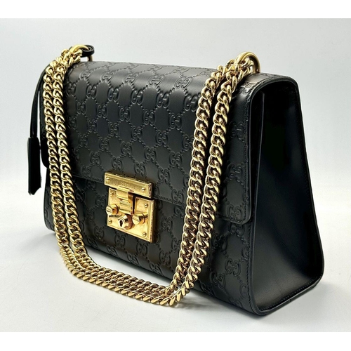 150 - A Gucci Guccissima Padlock Shoulder Bag. Guccissima monogram-embossed black leather exterior with go... 