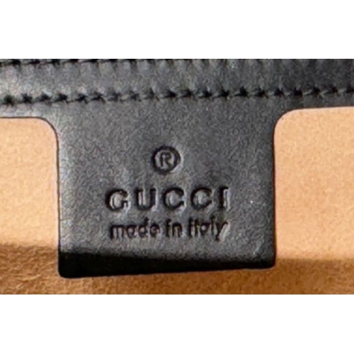 150 - A Gucci Guccissima Padlock Shoulder Bag. Guccissima monogram-embossed black leather exterior with go... 