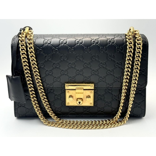 150 - A Gucci Guccissima Padlock Shoulder Bag. Guccissima monogram-embossed black leather exterior with go... 