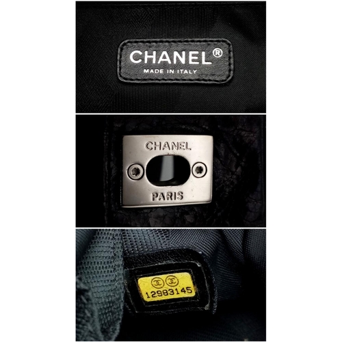 157 - A Chanel Black Portobello Tote Bag. Hand and shoulder straps. Colourful tweed and black textile inte... 