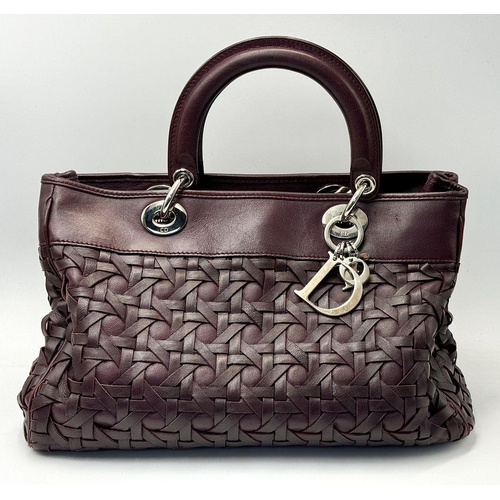 171 - A Christian Dior Woven Lambskin Avenue Small Tote Bag. Woven burgundy leather exterior with silver t... 