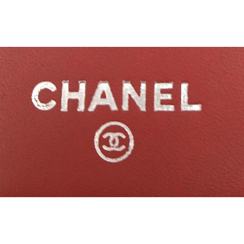 207 - A Chanel Patent Red Leather Clutch Purse/Wallet. A perfect diamond formation with the classic Chanel... 