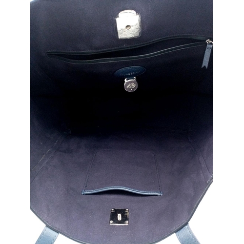 214 - A Mulberry Blue Tessie Leather Tote Bag. Blue leather exterior with silver-toned hardware and dual l... 