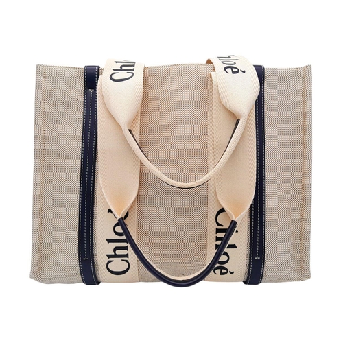 221 - A Chloe Cotton Calfskin Woody Ribbon Tote Bag. Beige canvas exterior with black leather trim and dou... 