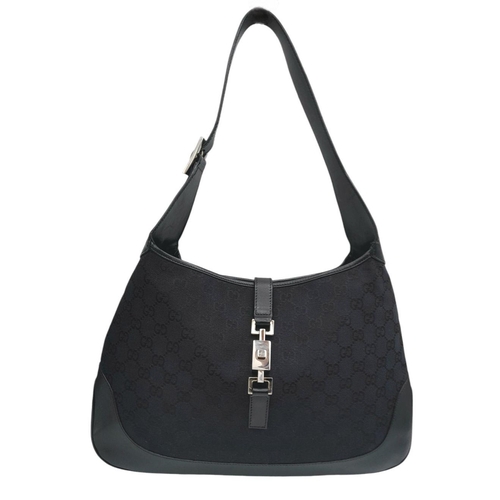 228 - A Gucci Black GG Monogram Canvas and Leather Hobo Bag. GG monogram canvas exterior with leather trim... 