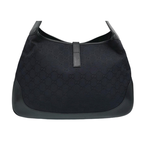 228 - A Gucci Black GG Monogram Canvas and Leather Hobo Bag. GG monogram canvas exterior with leather trim... 