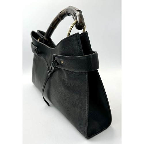 235 - A Gucci Black Bamboo Handle Tote Bag. Black leather exterior with bamboo handles, gold-toned hardwar... 