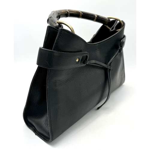 235 - A Gucci Black Bamboo Handle Tote Bag. Black leather exterior with bamboo handles, gold-toned hardwar... 