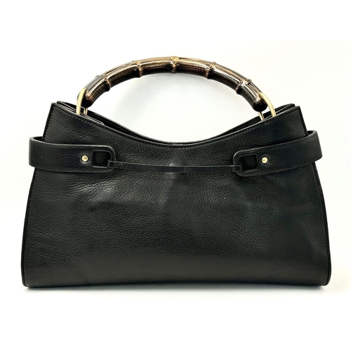 235 - A Gucci Black Bamboo Handle Tote Bag. Black leather exterior with bamboo handles, gold-toned hardwar... 