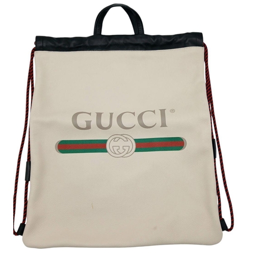 249 - A Gucci Large White Leather Tote/Backpack Bag. Decorative Gucci logo decoration with black leather t... 