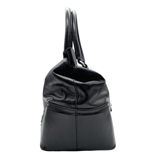 277 - A Dolce & Gabbana Black Patent Leather Bag. Leather exterior with silver-tone hardware, protective m... 