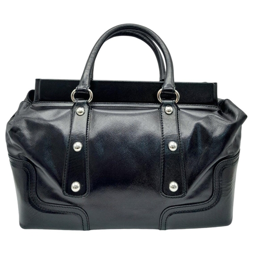 277 - A Dolce & Gabbana Black Patent Leather Bag. Leather exterior with silver-tone hardware, protective m... 