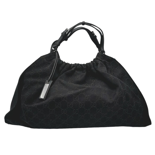 291 - A Gucci Black Monogram Hobo Bag. Monogram canvas exterior with leather trim, silver-toned hardware, ... 