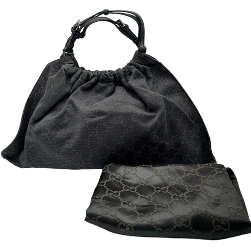 291 - A Gucci Black Monogram Hobo Bag. Monogram canvas exterior with leather trim, silver-toned hardware, ... 