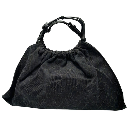 291 - A Gucci Black Monogram Hobo Bag. Monogram canvas exterior with leather trim, silver-toned hardware, ... 