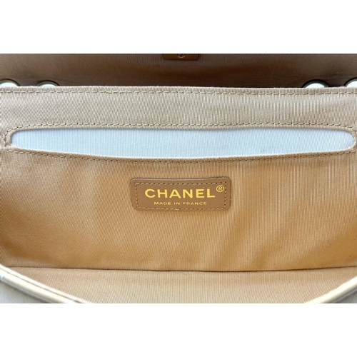 32 - A Beautiful Chanel Caramel Patent Leather Shoulder Bag. Gold tone hardware. Textile interior. Comes ... 