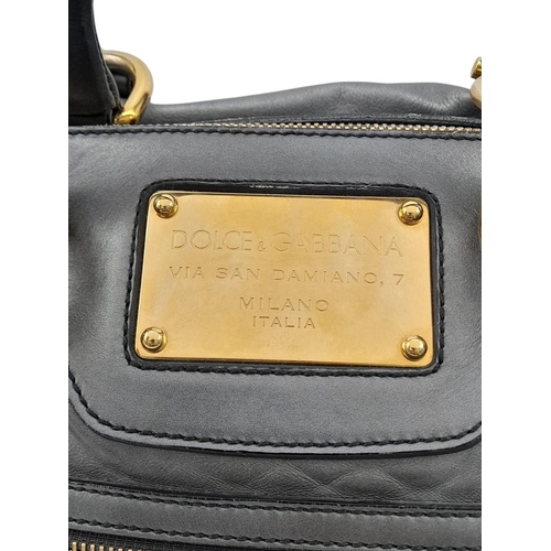 347 - A Dolce and Gabbana Via San Damiano Hand/Shoulder Bag. Metallic grey leather exterior. Gold tone har... 