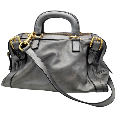 347 - A Dolce and Gabbana Via San Damiano Hand/Shoulder Bag. Metallic grey leather exterior. Gold tone har... 