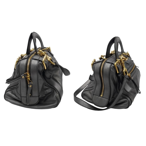 347 - A Dolce and Gabbana Via San Damiano Hand/Shoulder Bag. Metallic grey leather exterior. Gold tone har... 