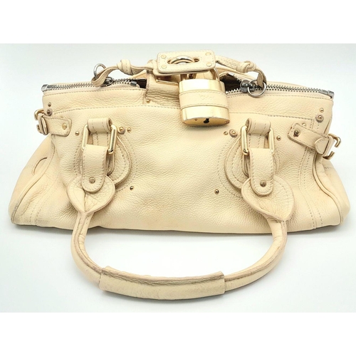 354 - A Chloé Paddington Large Cream Satchel. Leather exterior with gold-toned hardware, dual rolled leath... 