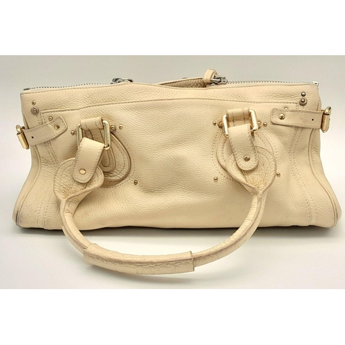 354 - A Chloé Paddington Large Cream Satchel. Leather exterior with gold-toned hardware, dual rolled leath... 