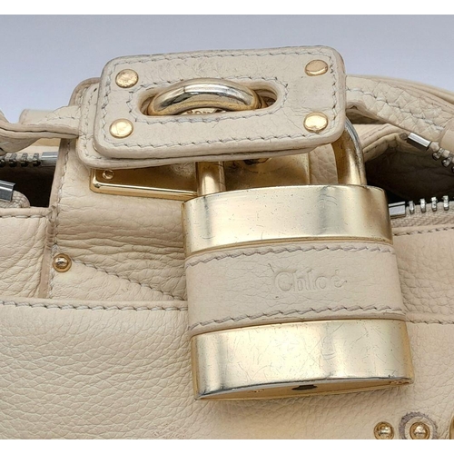 354 - A Chloé Paddington Large Cream Satchel. Leather exterior with gold-toned hardware, dual rolled leath... 