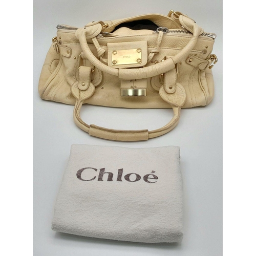 354 - A Chloé Paddington Large Cream Satchel. Leather exterior with gold-toned hardware, dual rolled leath... 