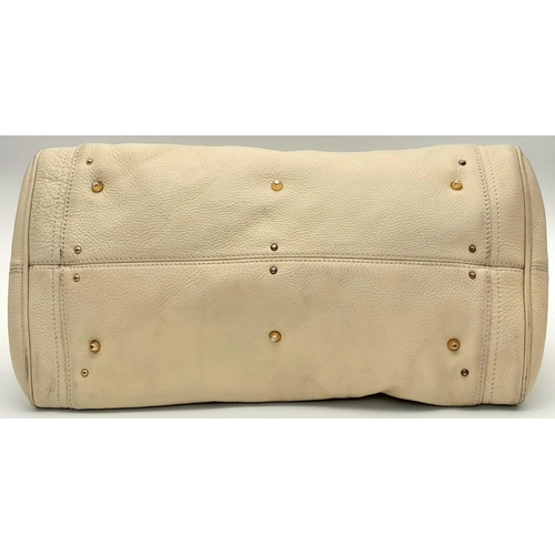 354 - A Chloé Paddington Large Cream Satchel. Leather exterior with gold-toned hardware, dual rolled leath... 