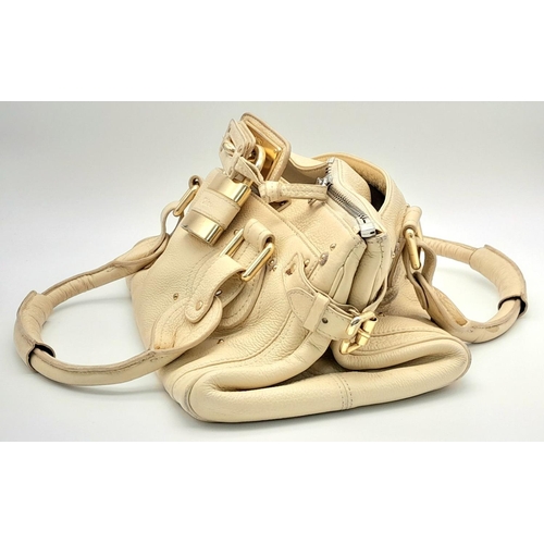 354 - A Chloé Paddington Large Cream Satchel. Leather exterior with gold-toned hardware, dual rolled leath... 