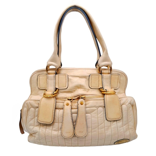 375 - A Chloe Seekins Precisions Handbag. Quilted cream leather exterior with gold-toned hardware. Feature... 