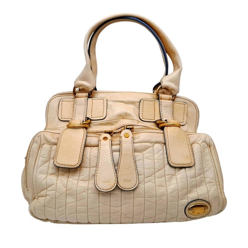 375 - A Chloe Seekins Precisions Handbag. Quilted cream leather exterior with gold-toned hardware. Feature... 