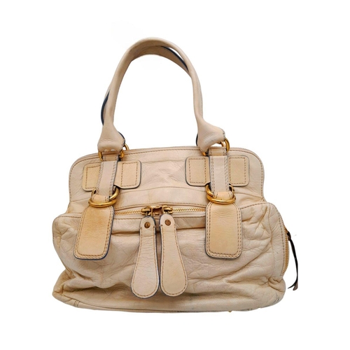 375 - A Chloe Seekins Precisions Handbag. Quilted cream leather exterior with gold-toned hardware. Feature... 