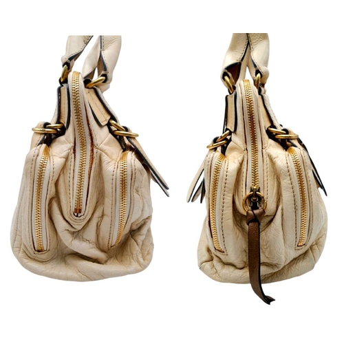 375 - A Chloe Seekins Precisions Handbag. Quilted cream leather exterior with gold-toned hardware. Feature... 