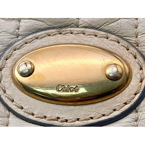 375 - A Chloe Seekins Precisions Handbag. Quilted cream leather exterior with gold-toned hardware. Feature... 