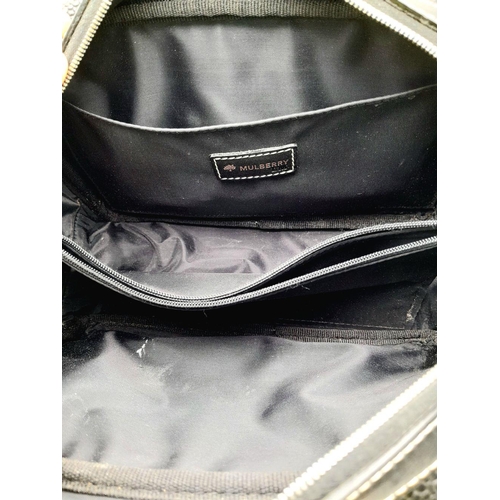 382 - A Mulberry Black Toiletry Pouch Bag. Leather exterior, silver-toned hardware, single zipped top clos... 