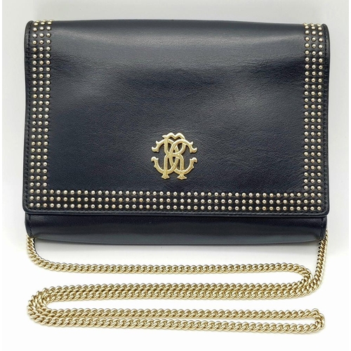 389 - A Roberto Cavalli Small Black Leather Crossbody Bag. Exterior stud and monogram decoration. Gold ton... 