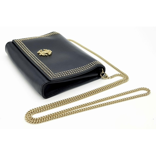 389 - A Roberto Cavalli Small Black Leather Crossbody Bag. Exterior stud and monogram decoration. Gold ton... 