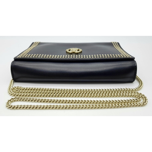 389 - A Roberto Cavalli Small Black Leather Crossbody Bag. Exterior stud and monogram decoration. Gold ton... 