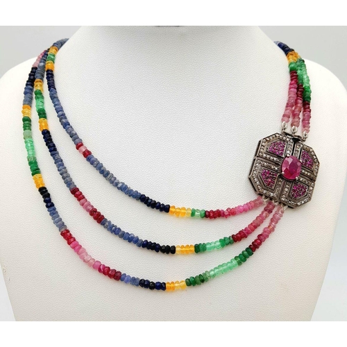 398 - A Three Row Multi-Sapphire Beaded Necklace. With a Ruby & Diamond encrusted clasp. Set in 925 Sterli... 