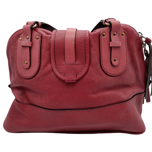 430 - A Chloe Fuchsia Leather Charm Detail Tote Bag. Pink leather exterior with gold-tone hardware and a d... 