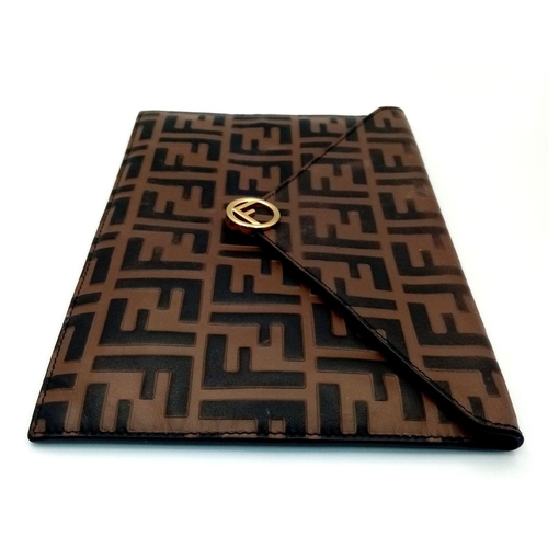 445 - A Fendi Zucca Monogram Envelope Clutch Bag. Brown and black coated canvas exterior with gold-toned h... 