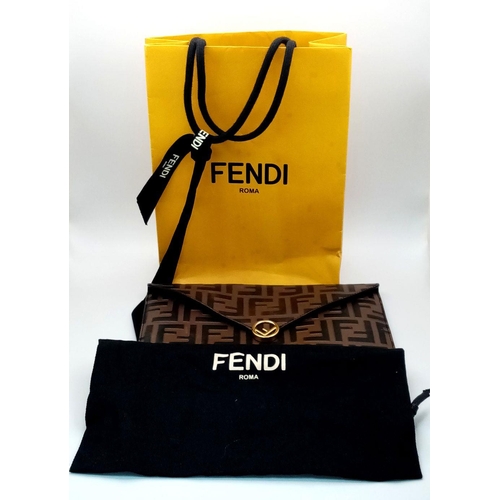 445 - A Fendi Zucca Monogram Envelope Clutch Bag. Brown and black coated canvas exterior with gold-toned h... 