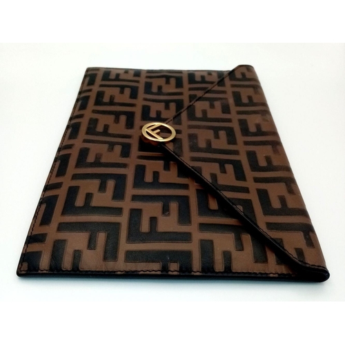 445 - A Fendi Zucca Monogram Envelope Clutch Bag. Brown and black coated canvas exterior with gold-toned h... 