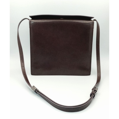 473 - A Gucci Brown Leather Crossbody Bag. Brown leather exterior with gold-toned hardware and a magnetic ... 