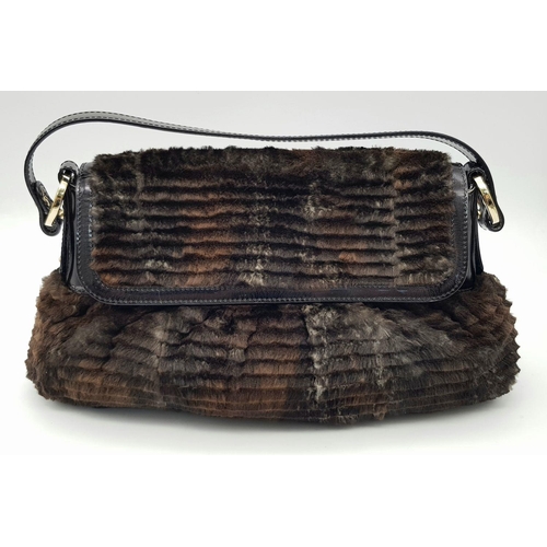 487 - A Fendi Patent Leather and Faux Fur Textile Handbag. Blue textile interior. 30cm length x 22cm heigh... 